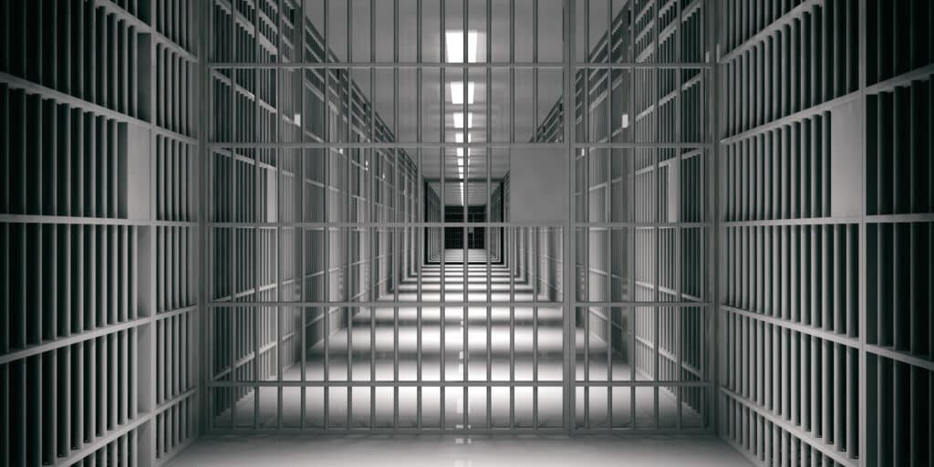 Jail cell door symbolizing tax fraud consequences for dentists